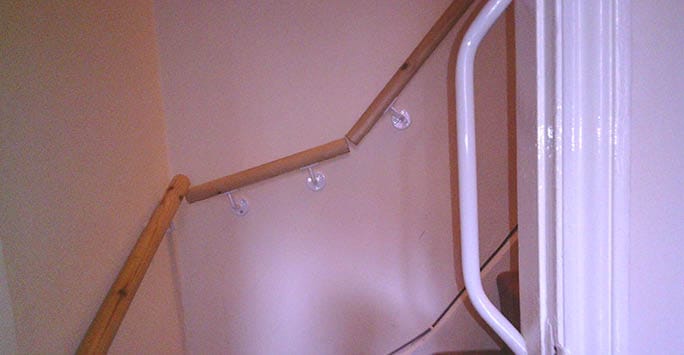 Staircase with handrails highlighting mobility challenges related to frailty among diverse ethnic groups.